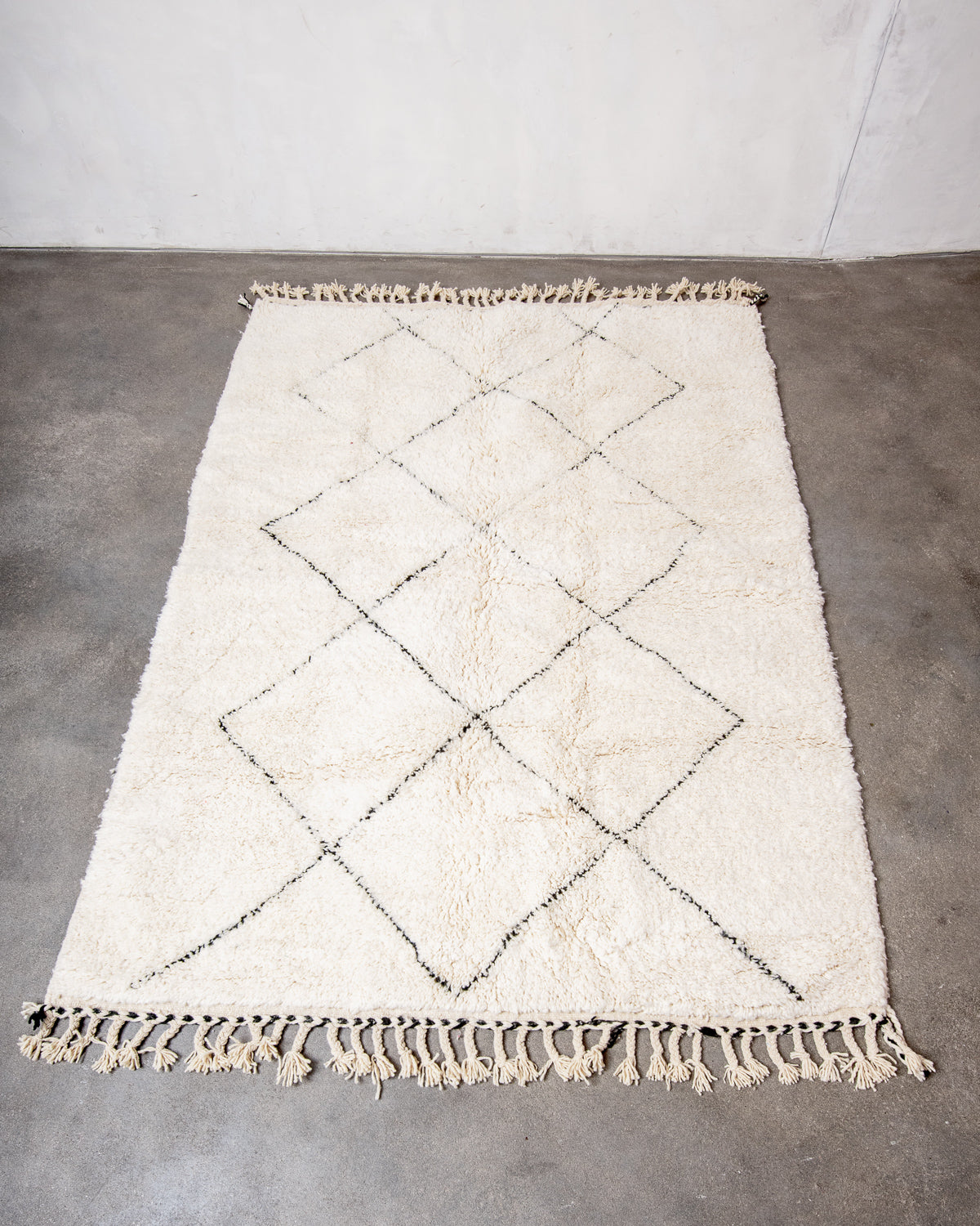 Modern, designer, handcrafted Berber rug from Morocco. Beniourain carpet with minimalist design, natural wool pile and a fluffy texture.